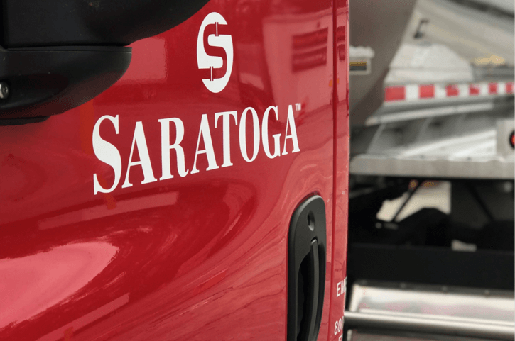 Red door of semi-truck with Saratoga Logo